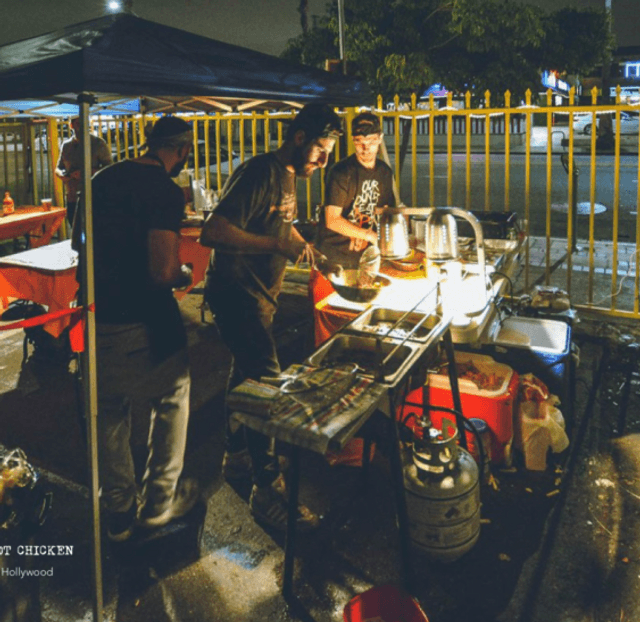 Original pop up photo of founders cooking
